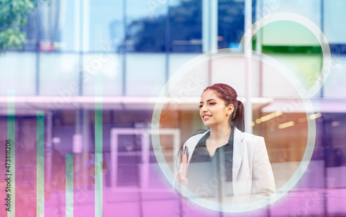 Smiling businesswoman with laptop in circular icon photo