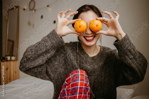 woman with mandarins at home