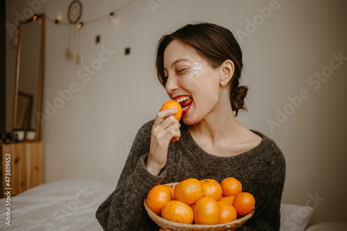 woman with mandarins at home