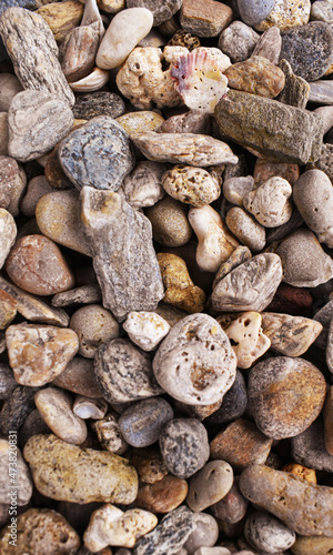 Abstract background with pebbles - round sea stones. abstract stones with dry round reeble stones