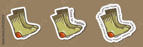 Colorful hand-drawn cold days mood stickers set with wooly socks in doodle style and lettering isolated on white background. Cute vector collection for seasonal decoration.