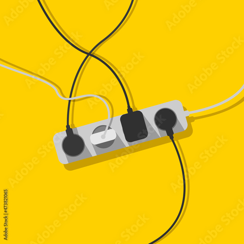 Electric extension cord. A mess of cables from extension cord, electrical wires, cords and chargers on a yellow background. Power strip. Cable management. Electric overload.