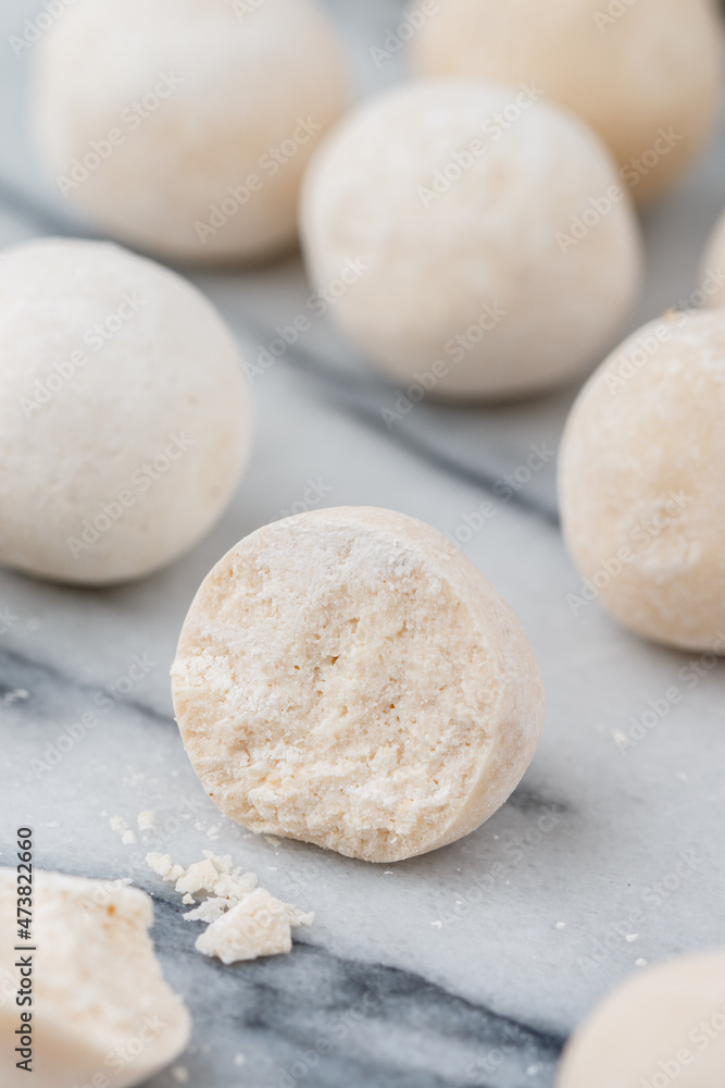 Kurut (kurt)  cheese -  traditional Asian cheese made from sheep's, goat's or cow's milk. Kazakh and Kyrgyz national food. white salty balls from dry cheese close-up on marble background