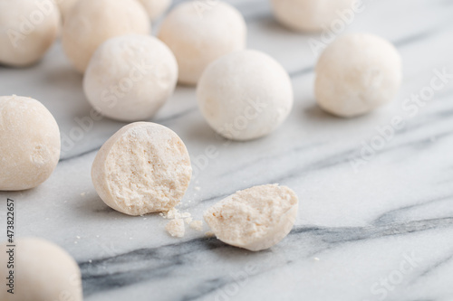 Kurut (kurt)  cheese -  traditional Asian cheese made from sheep's, goat's or cow's milk. Kazakh and Kyrgyz national food. white salty balls from dry cheese close-up on marble background photo