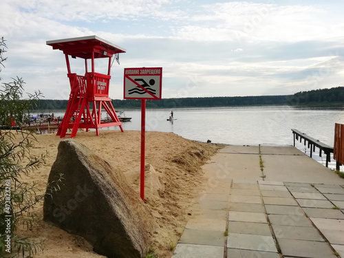 Sysert, Russia - July 29 2021: Red Lifeguard Tower on the beach  photo