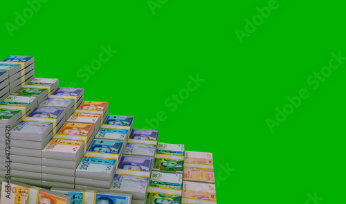 Moroccan money. Stack of banknotes of one hundred and two hundred and fifty dirhams. Conceptual illustration. Isolated on a green background. 3D rendering photo