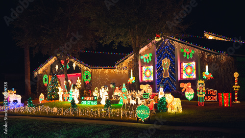 Christmas lights. House decorated on Christmas. Snowman, Santa Claus Reindeer sleigh, Polar bear. Winter Holiday. Merry Christmas and Happy New Year. American suburbs. Florida winter vacations. 