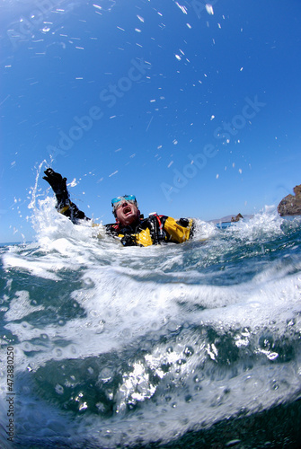Male scuba diver in extreme panic at surface. © Joseph