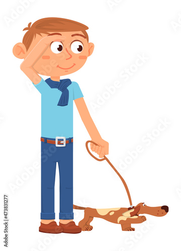 Boy walking with dog. Kid holding puppy on leash