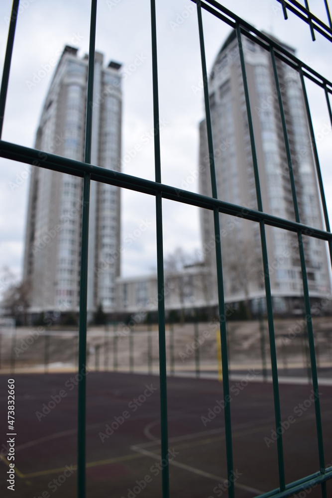 buildings behind the fence buildings behind the fence