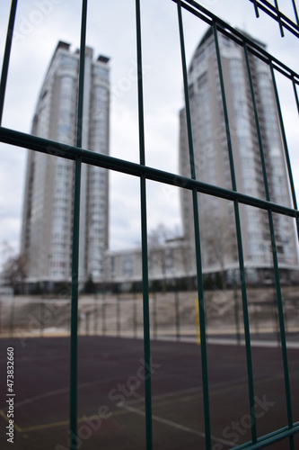 buildings behind the fence
