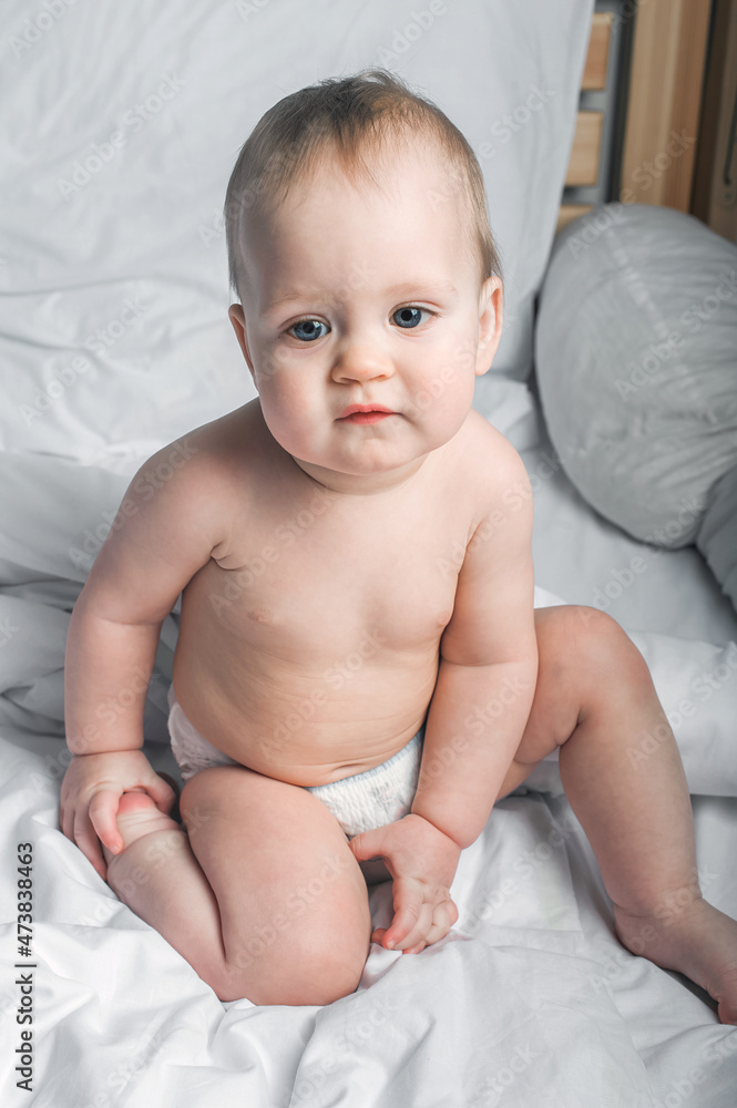 Child 1 year old on bed close-up.. Child 1 year old on bed close-up..