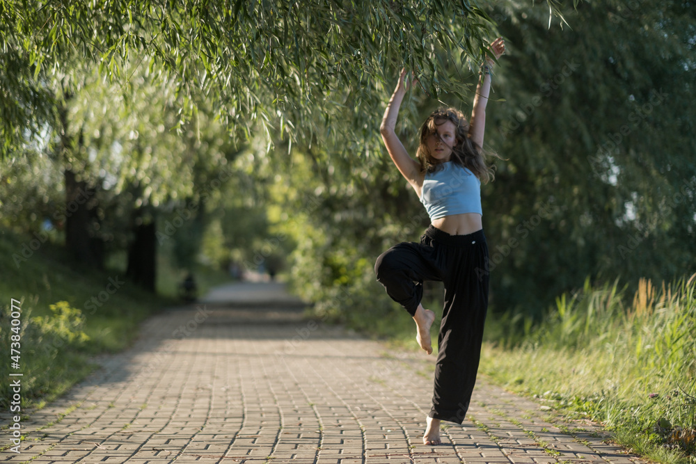 Girl dancing  in the park