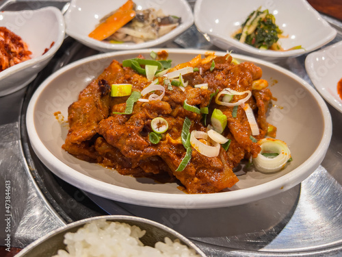 Various side dishes and stir-fried pork at a Korean restaurant
