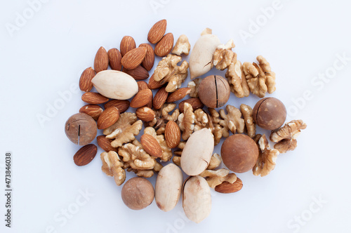 a set of nuts of different types lies on a light background