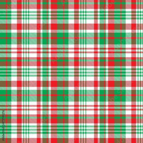 Chirstmas plaid pattern. Colorful tartan plaid pattern. Multicolor check plaid in white, green and red for fabric and textile design.