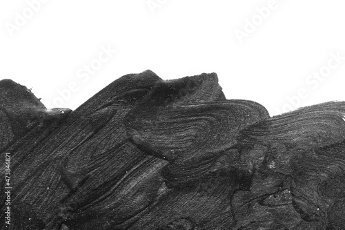 Black brush strokes on white paper isolated. Black brush strokes oil paints on white paper. Isolated on white background. Abstract creative white black background