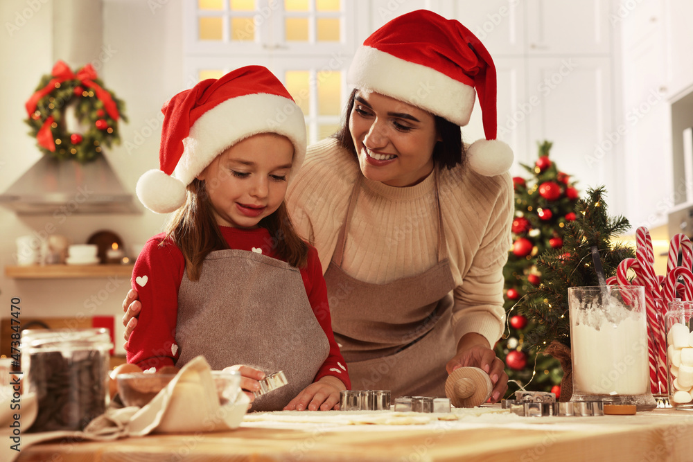 Happy mother and her daughter making delicious Christmas cookies at home Happy mother and her daughter making delicious Christmas cookies at home