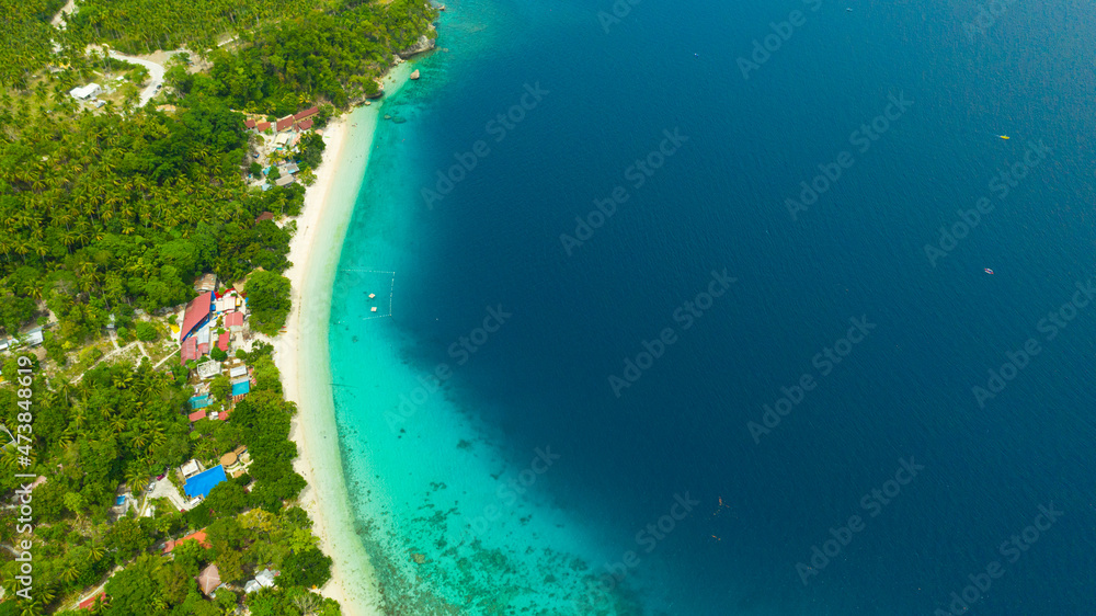 Tropical sandy beach with wave and turquoise water,copy space for text, aerial view. Sea water surface in lagoon. Transparent turquoise ocean water surface. Background texture