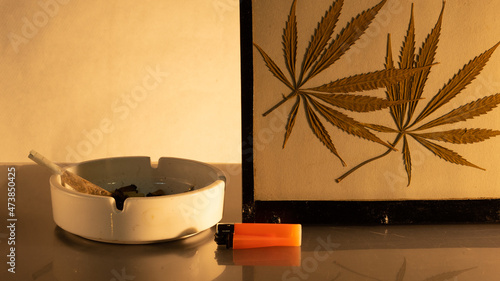 Slika na platnu ashtray lighter and marijuana leaves