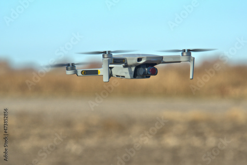 Close up view of a drone flying with props a blur 