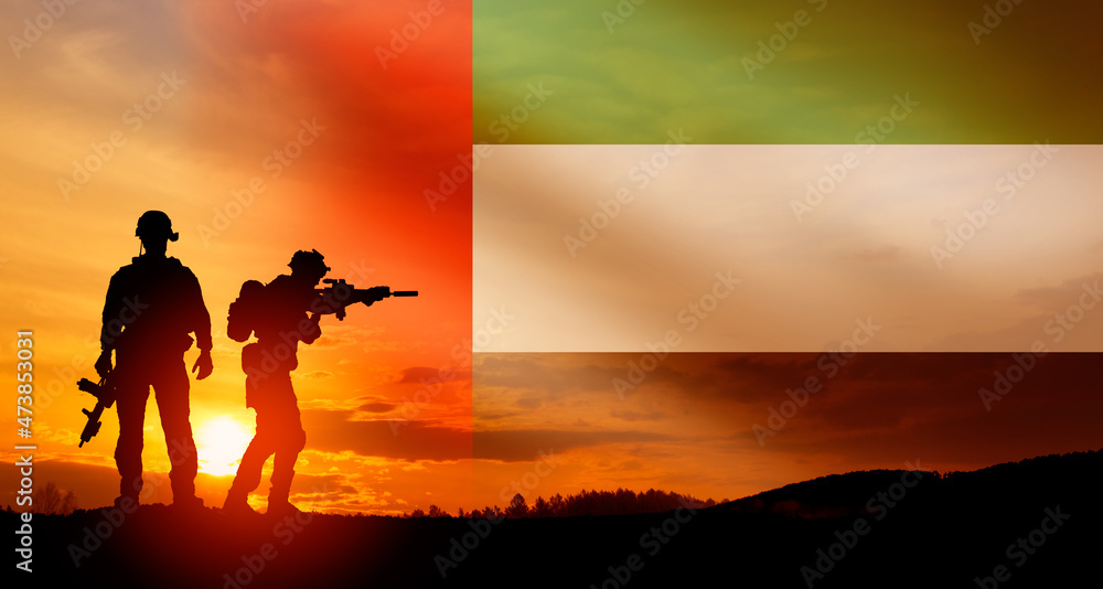 Silhouette of soldiers against the flag of UAE. Concept of national holidays. Commemoration Day. Silhouette of soldiers against the flag of UAE. Concept of national holidays. Commemoration Day.