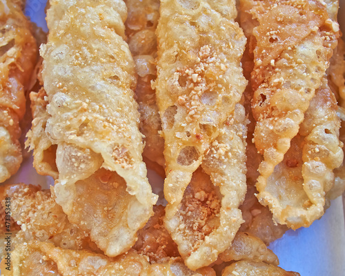 Diples closeup, traditional Greek gourmet sweet fries with honey syrup and nuts photo