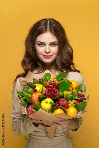 cheerful woman fashionable hairstyle bouquet of flowers decoration colorful background