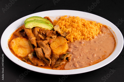 Photography Bistec ranchero- Beef and potatoes platter