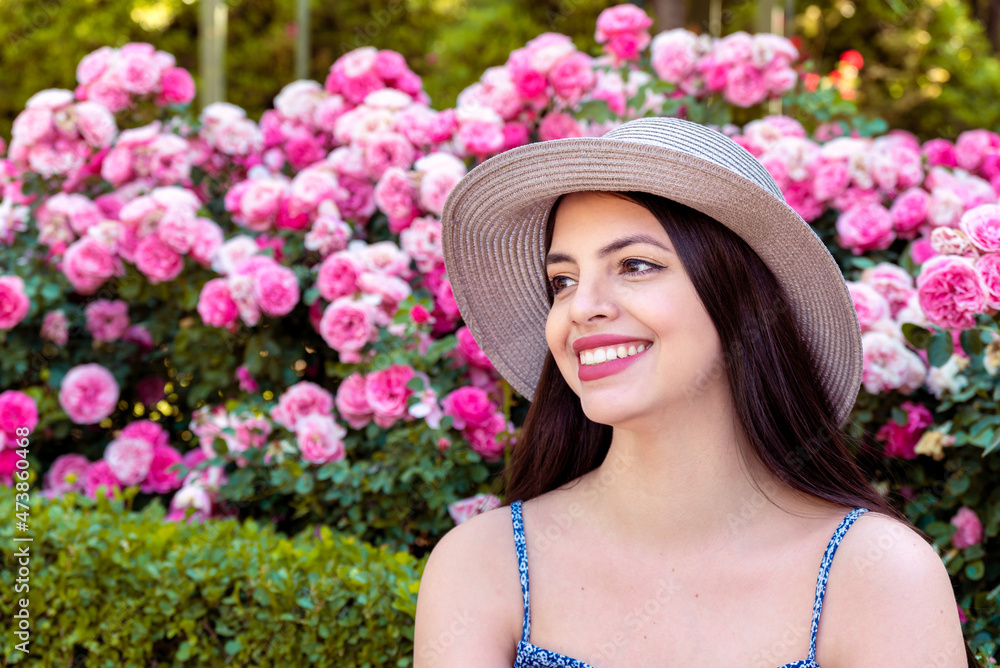 Young woman portrait using hat at park at spring summer season