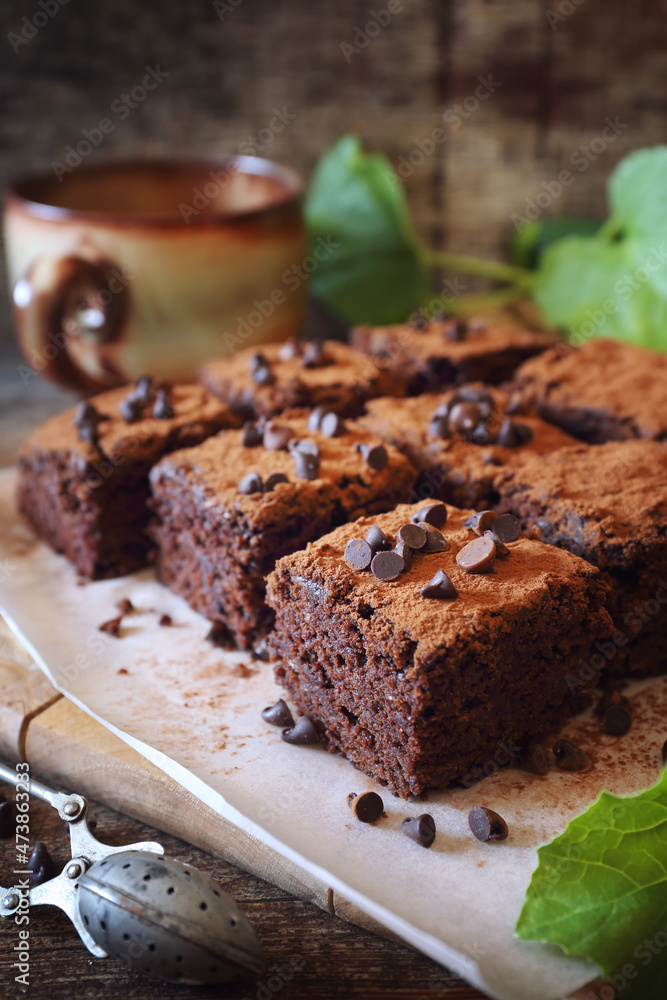 Chocolate Zucchini brownie with chocolate chips, cocoa powder dressing Chocolate Zucchini brownie with chocolate chips, cocoa powder dressing