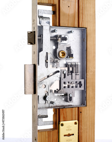 Mortise lock fitted in wooden door photo