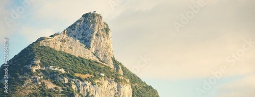 Rocky shores (cliffs, mountains) of the Europa Point, a view from the sailing boat. Gibraltar, British Overseas Territory. Travel destinations, national landmark, sightseeing theme