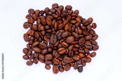 A group of roasted coffee beans  fresh brown in color  ready to be grinded and made drinks  the theme is freshness and relax