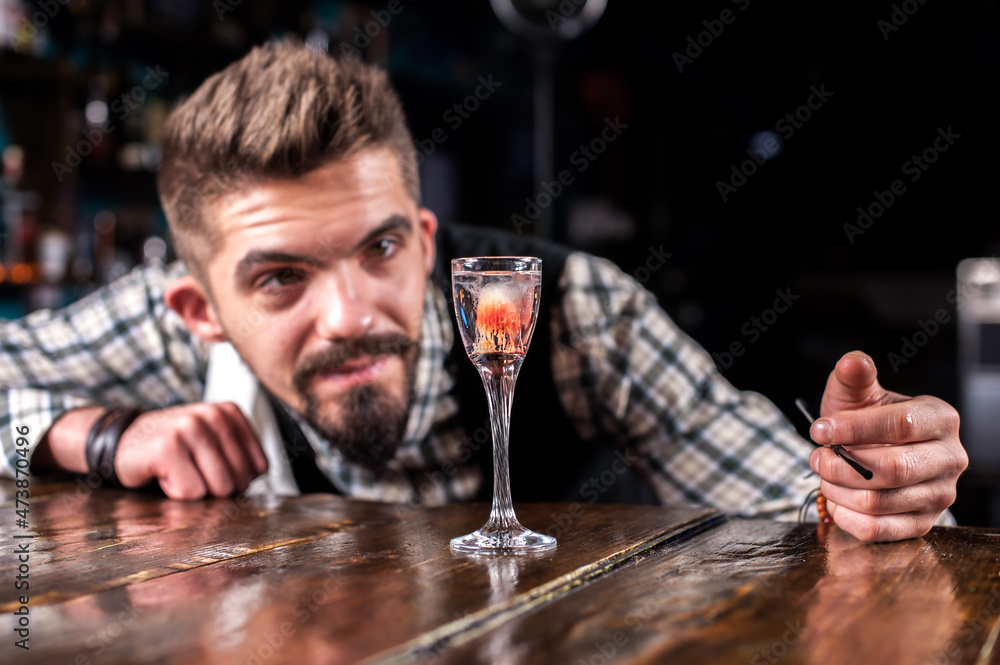 Barman creates a cocktail at the beerhouse