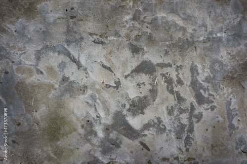 Texture of gray concrete with dark spots. Gray concrete background.
