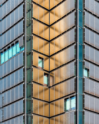 Geometric composition of an office building facade in golden sunset light