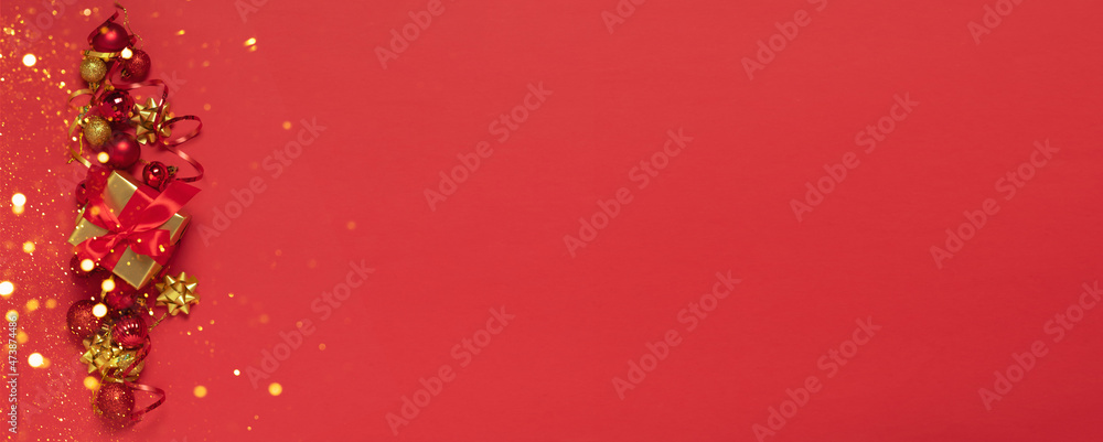 Christmas gold red decorations, gift with satin ribbon, Christmas balls toys, red background. New Years concept. Christmas gold red decorations, gift with satin ribbon, Christmas balls toys, red background. New Years concept.
