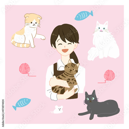 猫を抱っこするペットショップ店員