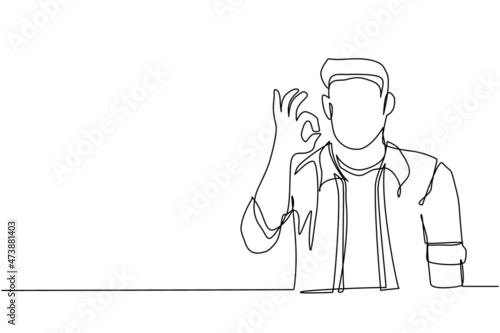 Continuous one line drawing man in casual clothes gesturing ok sign. Okay sign, gesture language concept. Smiling man standing showing ok sign with fingers. Single line draw design vector illustration
