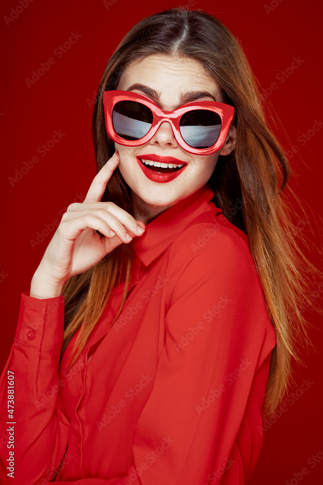 cheerful woman in a red shirt sunglasses Glamor close-up cheerful woman in a red shirt sunglasses Glamor close-up