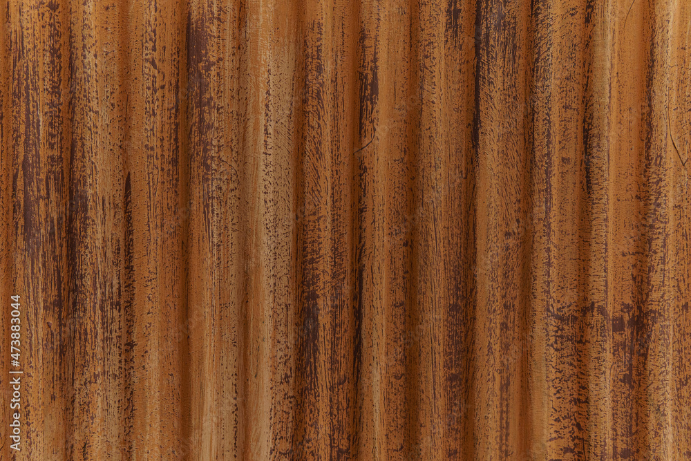 Texture of painted, rusty scratched metal. Rusty corrugated metal back Texture of painted, rusty scratched metal. Rusty corrugated metal back