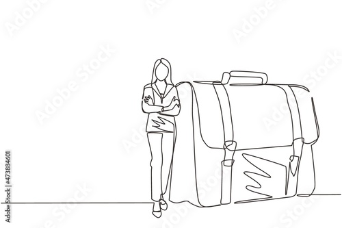 Continuous one line drawing modern confident female entrepreneur leaning on large briefcase. Happy pretty businesswoman standing with elegance pose. Single line draw design vector graphic illustration