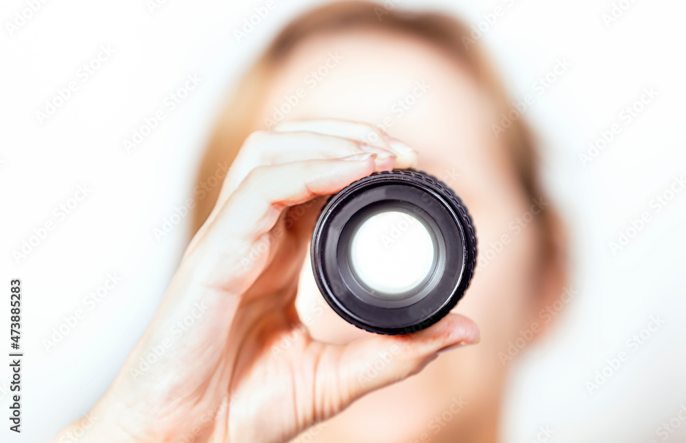 Close-up of hand holding the lens Close-up of hand holding the lens