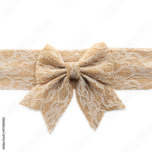Lacy burlap ribbon with pretty bow on white background, top view