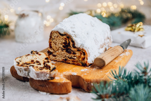 Traditional Christmass stollen on stone background.