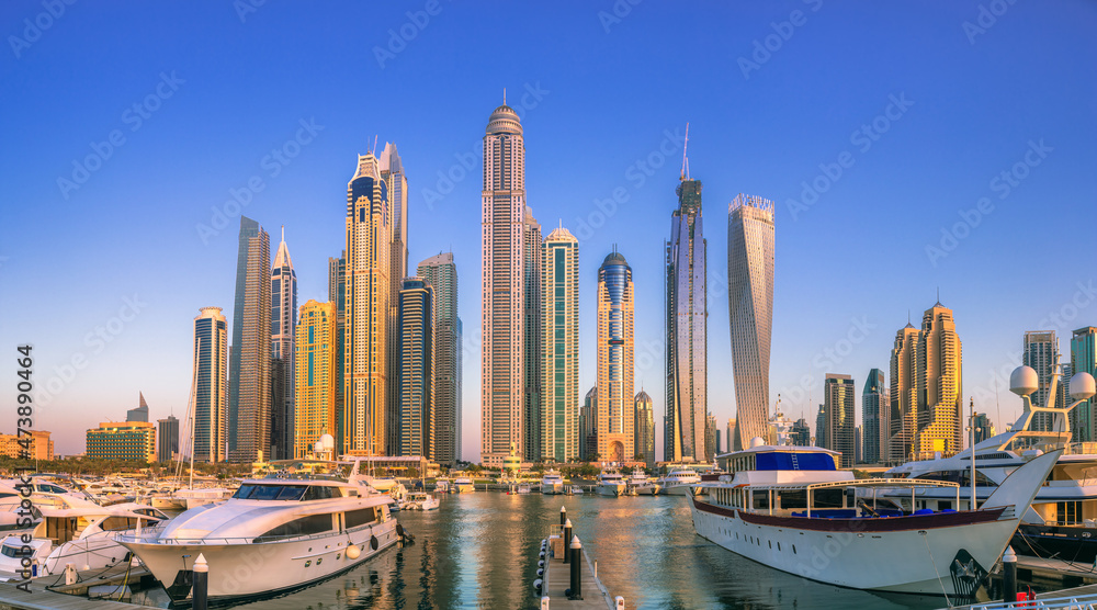 Day view of Dubai Marina bay with bridge, UAE