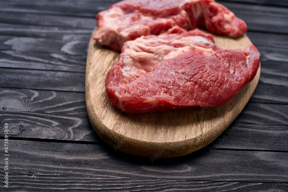meat steak on wooden board ingredients top view food