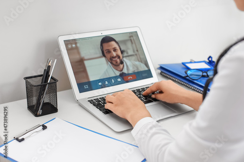 Doctor video chatting with ...