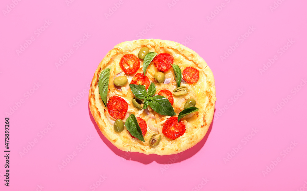 Delicious mini pizza on pink background
